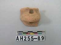 藏品(紅色夾砂帶鈕陶口緣殘件)的圖片